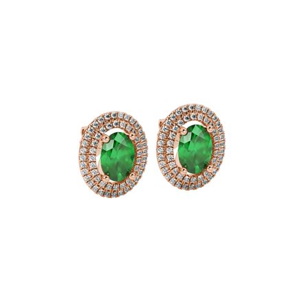 Close-up, oval cut emerald green gemstone earrings, rose gold double halo.