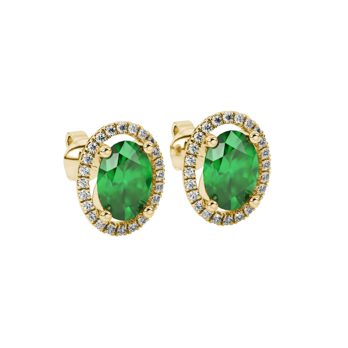 Close-up, oval cut emerald green gemstone, yellow gold french pavé halo earrings.