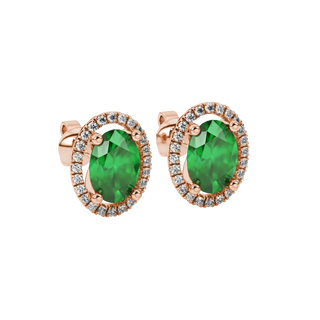 Close-up, oval cut emerald green gemstone earrings, rose gold french pavé halo.