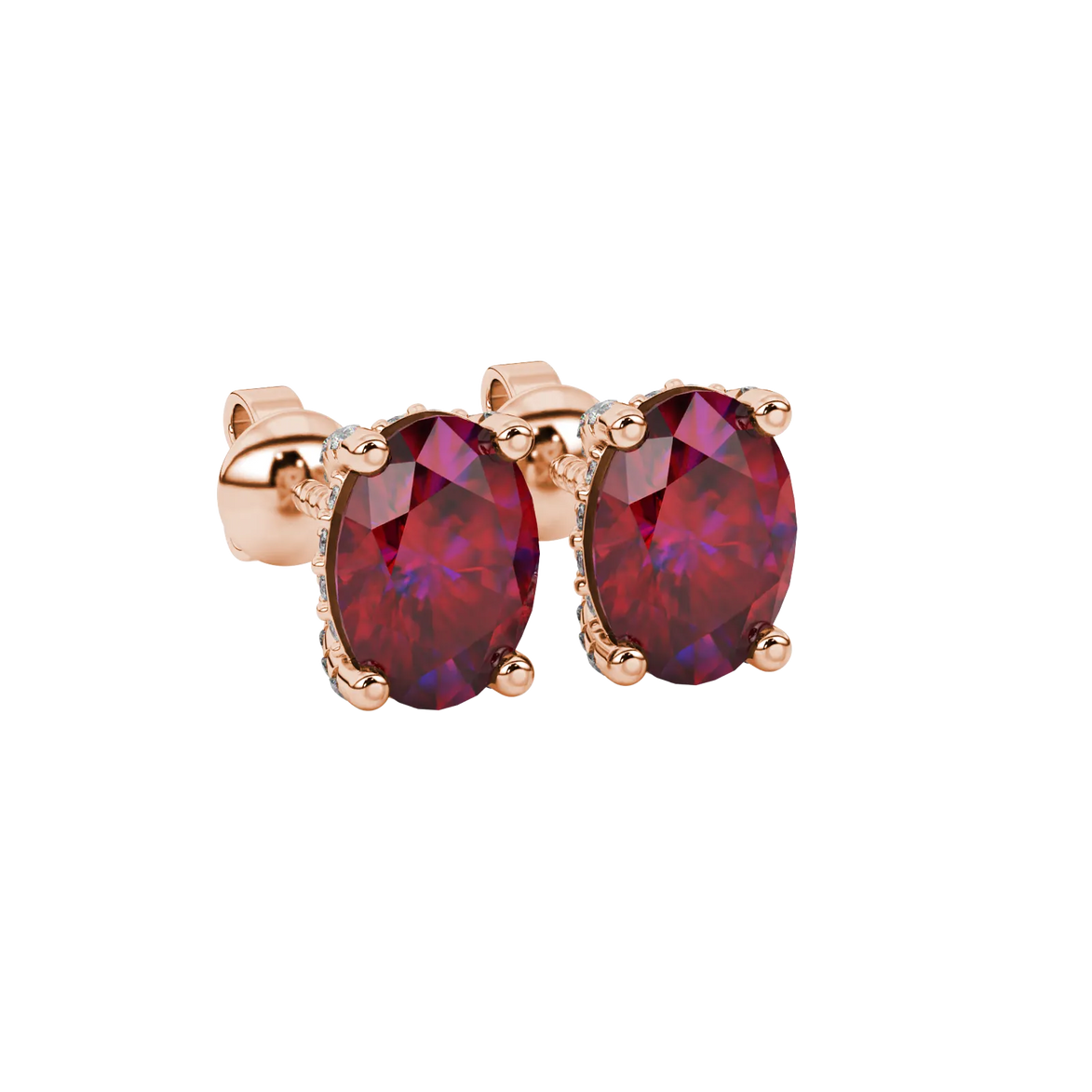 Close-up, oval cut raspberry red gemstone earrings, rose gold pavé basket.
