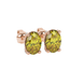 Close-up, oval cut canary yellow gemstone earrings, rose gold pavé basket.