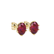 Close-up, oval cut raspberry red gemstone, yellow gold scalloped six prong earrings.