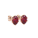 Close-up, oval cut raspberry red gemstone earrings, rose gold scalloped six prong setting.