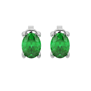 Oval cut emerald green gemstone earrings, white gold surprise diamond setting