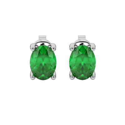 Oval cut emerald green gemstone earrings, white gold surprise diamond setting