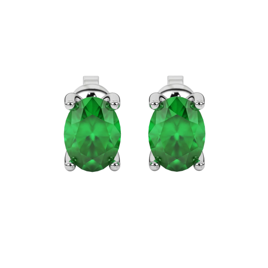 Oval cut emerald green gemstone earrings, white gold surprise diamond setting