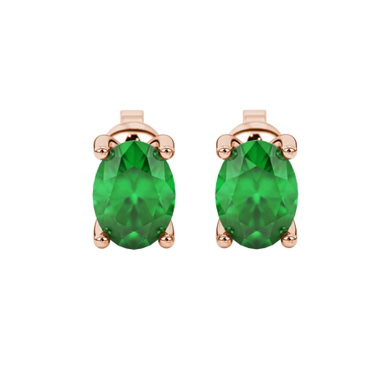 Oval cut emerald green gemstone earrings, rose gold surprise diamond setting.
