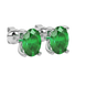 Close-up emerald green gemstone earing, white gold surprise diamond setting.