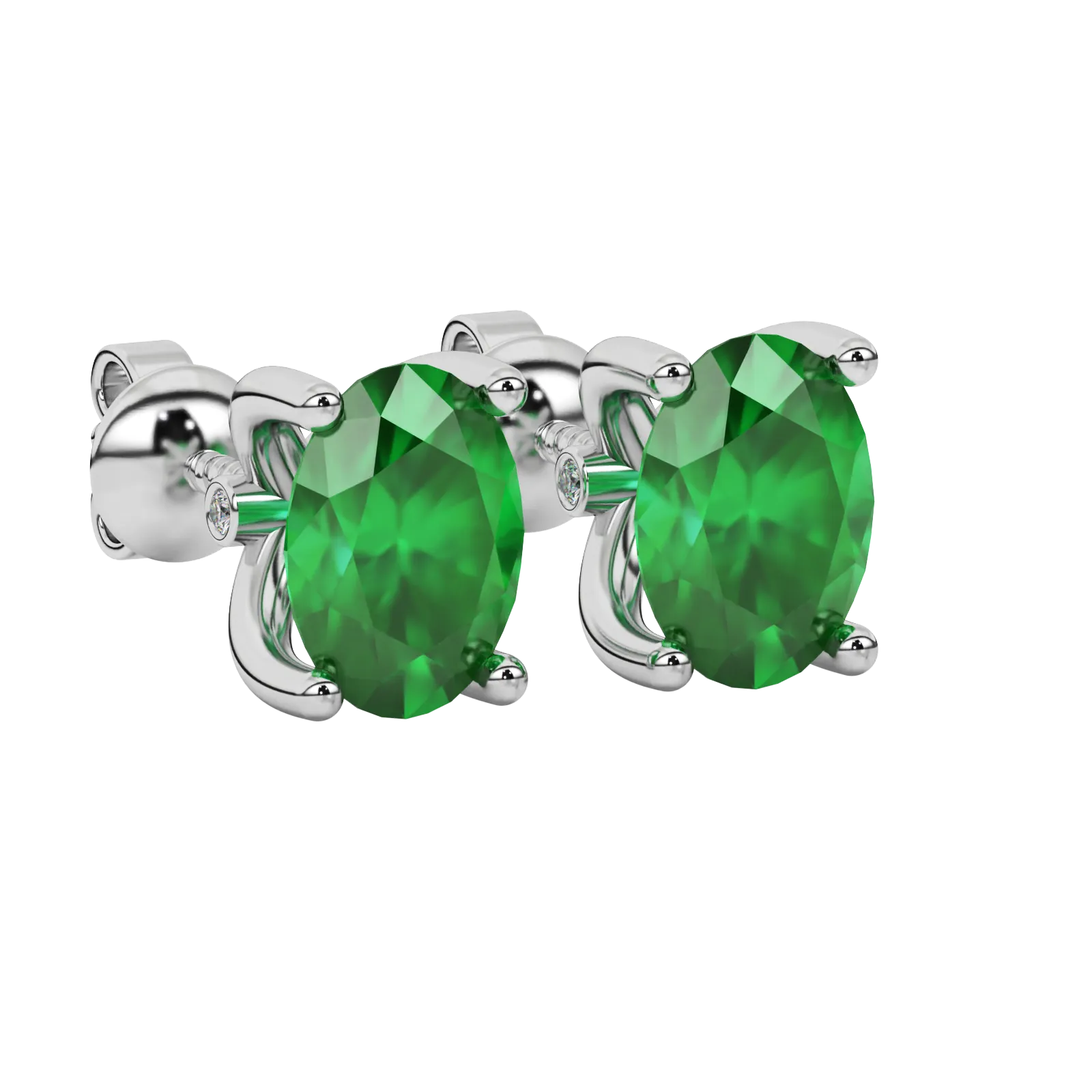 Close-up emerald green gemstone earing, white gold surprise diamond setting.