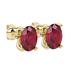Close-up, oval cut raspberry red gemstone, yellow gold surprise diamond earrings.