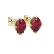 Close-up, oval cut raspberry red gemstone, yellow gold tulip basket earrings.
