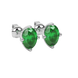 Close-up oval cut emerald green gemstone earing, white gold tulip basket.