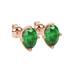Close-up, oval cut emerald green gemstone earrings, rose gold tulip basket.