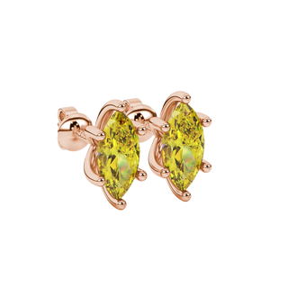 Close-up, marquise cut canary yellow gemstone earrings, rose gold six prong.