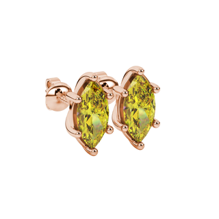 Close-up, marquise cut canary yellow gemstone earrings, rose gold classic basket.