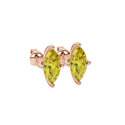 Close-up, marquise cut canary yellow gemstone earrings, rose gold surprise diamond setting.