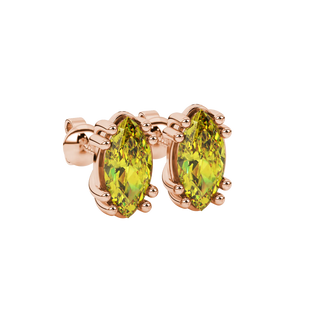 Close-up, marquise cut canary yellow gemstone earrings, rose gold vintage basket.