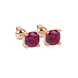 Red cushion cut gemstone solitaire stud earrings in gold featuring a refined four-prong basket setting