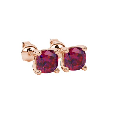 Red cushion cut gemstone stud earrings in white gold with four-prong basket setting