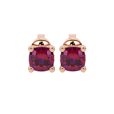 Red cushion cut gemstone stud earrings with hidden diamond halo in yellow gold