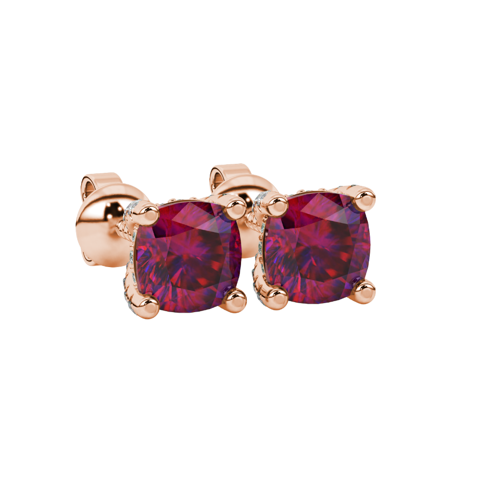 Red cushion cut solitaire gemstone ring in rose gold with classic four prong setting