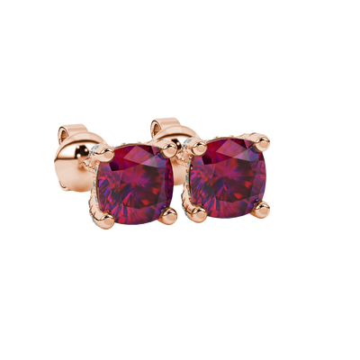 Red cushion cut gemstone stud earrings with hidden diamond halo in yellow gold