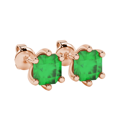 close-up shot of radiant-cut emerald green gemstone stud earrings with a classic rose gold six-prong setting