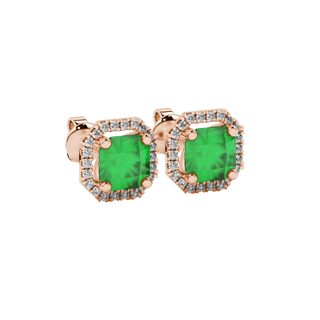 close-up shot of radiant-cut emerald green gemstone stud earrings with a rose gold french pavé halo gallery.