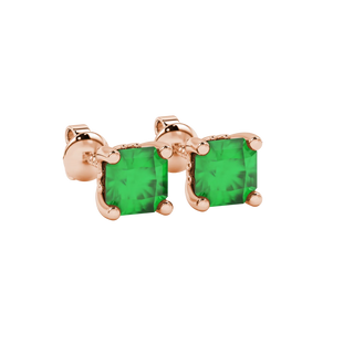 close-up shot of radiant-cut emerald green gemstone stud earrings with a rose gold lotus basket gallery.