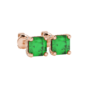 close-up shot of radiant-cut emerald green gemstone stud earrings with a rose gold pavé basket gallery.