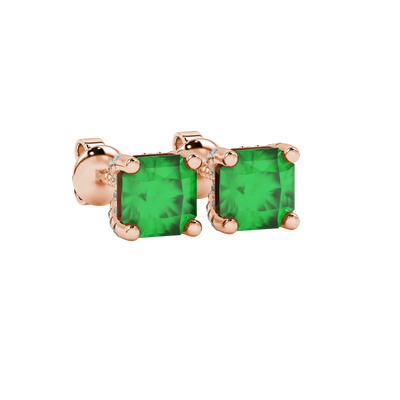 close-up shot of radiant-cut emerald green gemstone stud earrings with a rose gold pavé basket gallery.