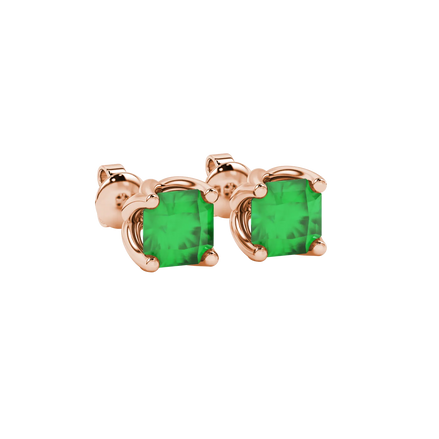 close-up shot of radiant-cut emerald green gemstone stud earrings with a rose gold tulip basket gallery.
