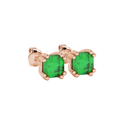close-up shot of radiant-cut emerald green gemstone stud earrings with a rose gold vintage basket gallery.