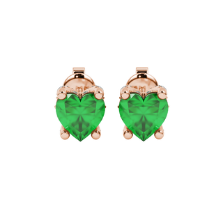 Close-up angled shot of Emerald Green heart cut pave basket halo earrings in rose gold