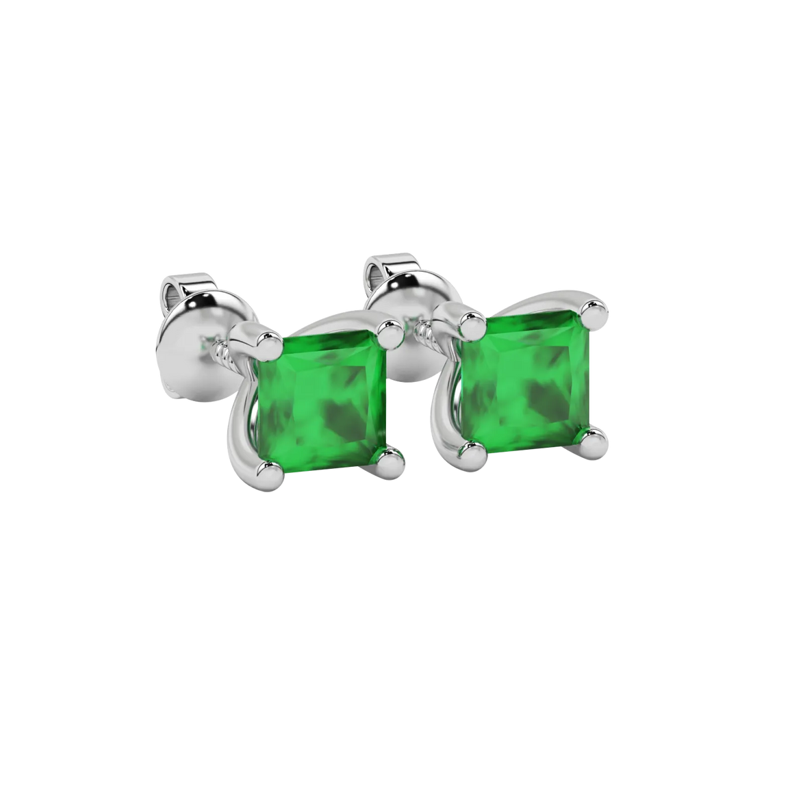Close-up emerald green gemstone earing, white gold four-prong setting.
