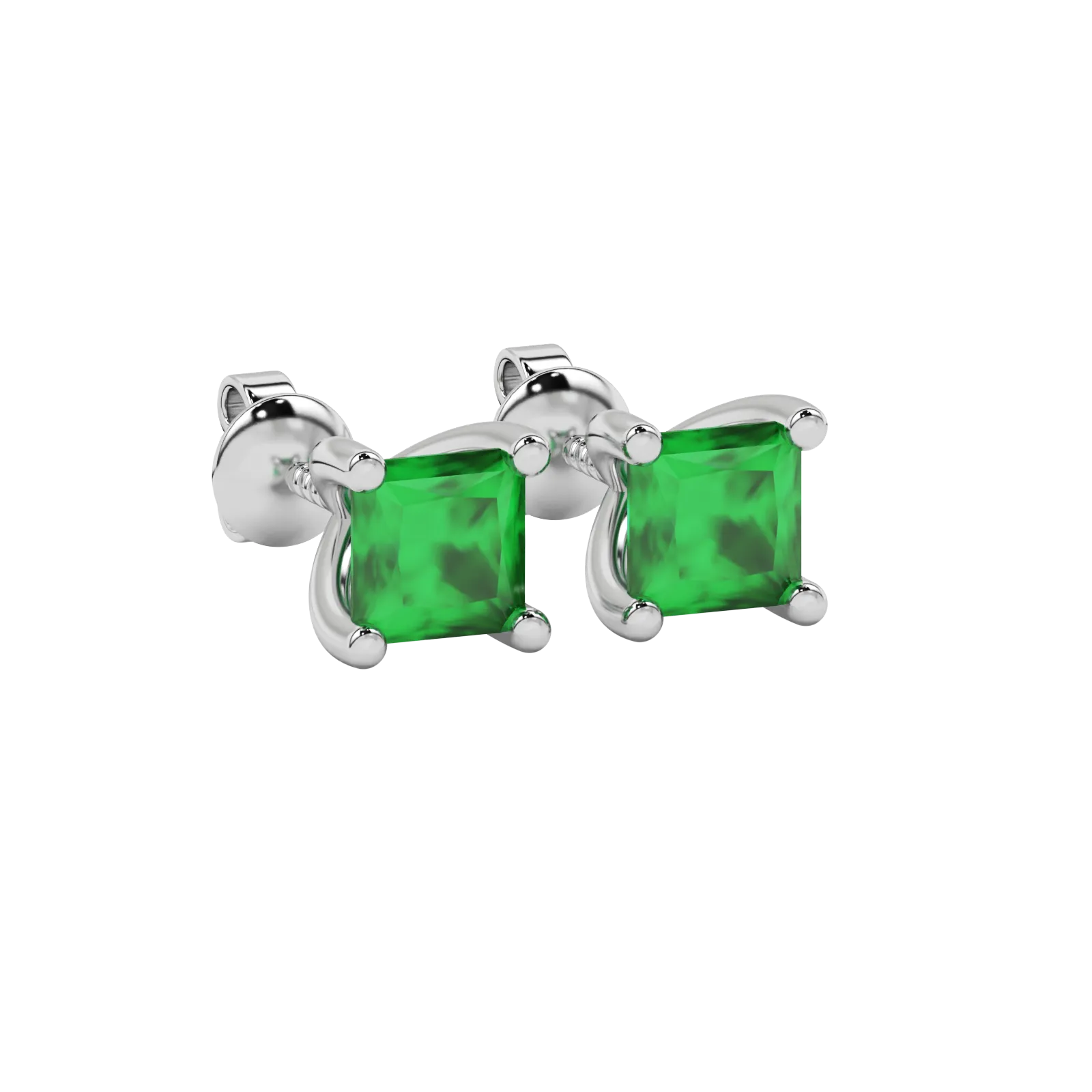 Close-up emerald green gemstone earing, white gold four-prong setting.