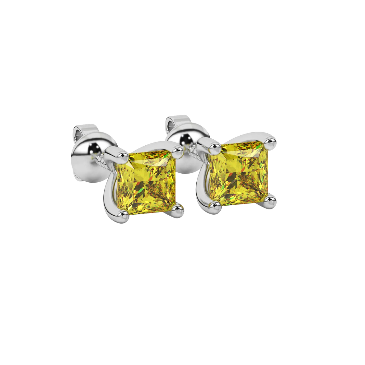 Close-up canary yellow gemstone earing, white gold four-prong setting.