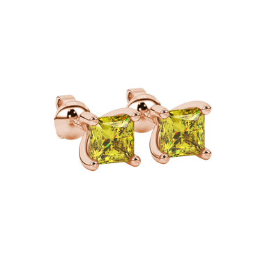 Close-up, princess canary yellow gemstone earrings, rose gold four-prong setting.