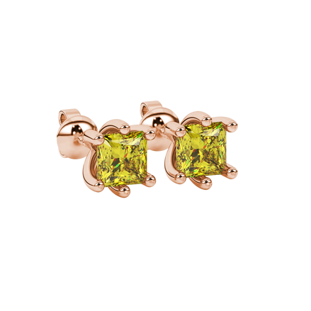 Close-up, princess canary yellow gemstone earrings, rose gold six-prong setting.