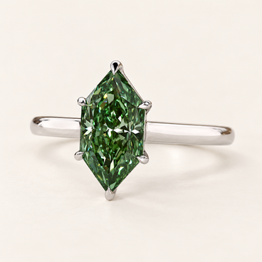 Green Dutch marquise cut lab grown diamond solitaire engagement ring with protective pointed-end prongs, four side claws and plain polished white gold shank.