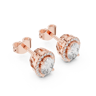 Side profile of rose gold oval cut halo diamond stud earrings.