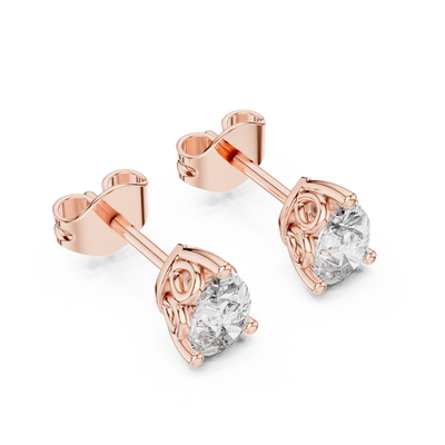Side profile of rose gold pear-shaped solitaire diamond studs.