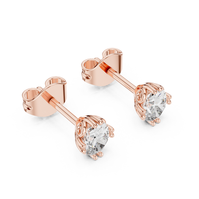 Side profile of rose gold oval cut solitaire diamond studs.