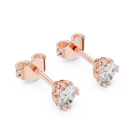 Side profile of rose gold oval cut solitaire diamond studs.