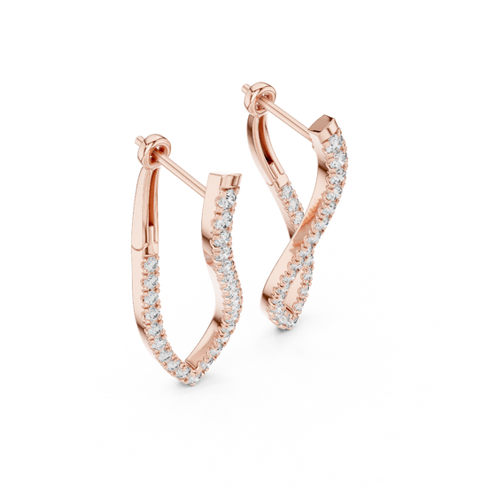 Side profile of rose gold twisting infinity diamond drop earrings.