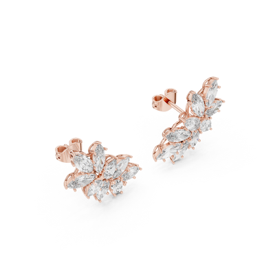 Side profile of rose gold marquise and pear diamond cluster earrings.