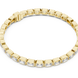 Gold bracelet with clear stones on a white background