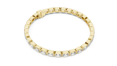 Gold bracelet with clear stones on a white background