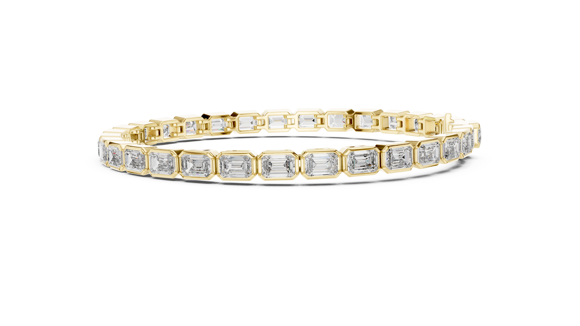 Gold bracelet with emerald-cut diamonds on a white background