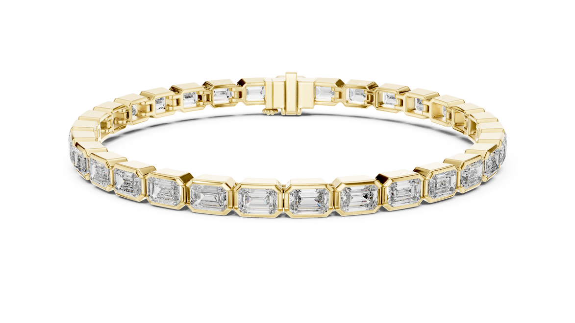 Gold bracelet with diamond accents on a white background